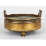 A 19TH CENTURY CHINESE BRONZE TRIPOD CENSER, weighing 755gm, the sides cast with a short waisted