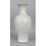 A LARGE 18TH/19TH CENTURY CHINESE WHITE CRACKLEGLAZE MOULDED PORCELAIN VASE, the sides with barbed