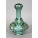 AN UNUSUAL 17TH/18TH CENTURY CHINESE MOULDED BOTTLE VASE, with a garlic neck, the sides applied with