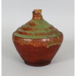 AN UNUSUAL STONEWARE JAR, possibly early Sawankhalok, the stepped shoulders with a pooled and