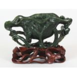 AN EARLY/MID 20TH CENTURY CHINESE SPINACH JADE MODEL OF AN OPEN LOTUS, together with a pierced and