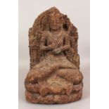 A GOOD INDIAN SANDSTONE CARVING OF A BODHISATTVA, 14th Century or earlier, possibly Chola, the deity