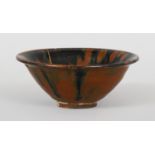 A CHINESE SONG DYNASTY TORTOISESHELL GLAZED BOWL, possibly Henan ware, the interior with streaked