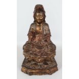 A LARGE CHINESE LACQUERED & GILT WOOD FIGURE OF GUANYIN, seated in meditation upon a double lotus