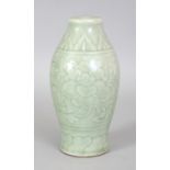 AN 18TH/19TH CENTURY CHINESE CELADON PORCELAIN VASE, with moulded underglaze decoration of scrolling