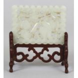 AN EARLY/MID 20TH CENTURY CHINESE PIERCED RECTANGULAR WHITE JADE PLAQUE, together with a fitted wood