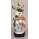 A LATE 19TH CENTURY CHINESE FAMILLE ROSE PORCELAIN VASE, fitted for electricity, painted with a