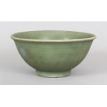 A CHINESE MING DYNASTY LONGQUAN CELADON STONEWARE BOWL, with an everted rim, the interior centre