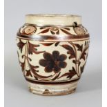 A CHINESE YUAN/MING DYNASTY CIZHOU CERAMIC JAR, the sides decorated in brown on a cream ground