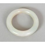 A CHINESE WHITE JADE BABY'S BANGLE, possibly 17th/18th Century, the stone of slightly mottled