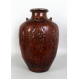 A LARGE CHINESE MING DYNASTY MARTABAN STONEWARE JAR, the sides with foliate moulded decoration