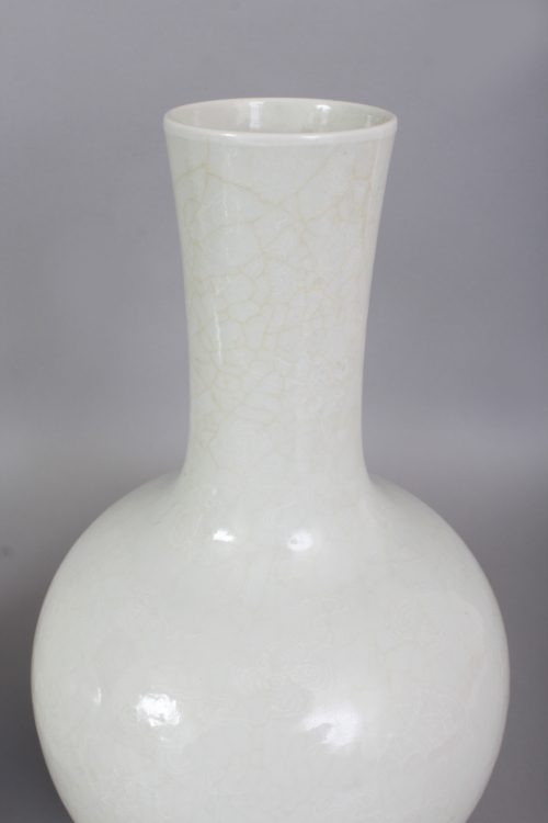 A PAIR OF 18TH/19TH CENTURY CHINESE WHITE GLAZED PORCELAIN BOTTLE VASES, each decorated in white - Image 2 of 8