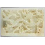 A FINE QUALITY CHINESE YUAN/MING DYNASTY WHITE JADE RECTANGULAR PLAQUE, deeply carved with a