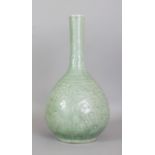 A LARGE 19TH CENTURY CHINESE CELADON PHOENIX BOTTLE VASE, the base bearing a Qianlong seal mark, the