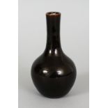 AN 18TH CENTURY CHINESE MONOCHROME BOTTLE VASE, applied with a deep brown near mirror-black lustrous