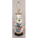 A LATE 19TH CENTURY CHINESE FAMILLE ROSE PORCELAIN VASE, fitted for electricity, the vase painted to