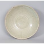 A CHINESE SONG DYNASTY PORCELAIN BOWL, possibly Yue ware, of rounded conical form, the interior with