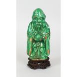 A CHINESE MING DYNASTY GREEN GLAZED FIGURE OF SHOU LAO, together with a carved and pierced