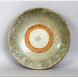 A LARGE 17TH/18TH CENTURY CHINESE PROVINCIAL PORCELAIN DISH, with an unglazed firing band to its