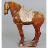 A GOOD CHINESE TANG DYNASTY CHESTNUT GLAZED POTTERY FIGURE OF A HORSE, standing four square on a