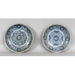 A PAIR OF 18TH/19TH CENTURY CHINESE PROVINCIAL PORCELAIN DISHES, of saucer shape, each painted