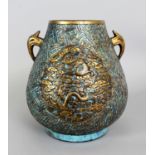 AN UNUSUAL CHINESE GILDED & ENAMELLED PORCELAIN HU VASE, 18th Century or later, imitating bronze and