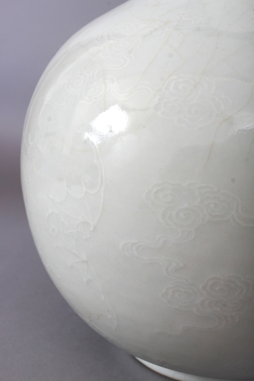 A PAIR OF 18TH/19TH CENTURY CHINESE WHITE GLAZED PORCELAIN BOTTLE VASES, each decorated in white - Image 3 of 8