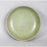 A CHINESE YUAN/MING DYNASTY LONGQUAN CELADON STONEWARE BOWL, of shallow form, the interior