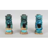 A GROUP OF THREE CHINESE MING DYNASTY TURQUOISE GLAZED STONEWARE JOSS STICK HOLDERS, each modelled