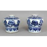 A PAIR OF CHINESE KANGXI PERIOD BLUE & WHITE PORCELAIN VASES, circa 1700, each painted with