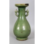 A CHINESE YUAN/MING DYNASTY LONGQUAN CELADON STONEWARE VASE, the pear-form body rising to a