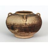 A 14TH/15TH CENTURY SAWANKHALOK JAR, with four lug handles and applied with a thin degraded glaze