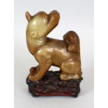 A 17TH CENTURY CHINESE LATE MING DYNASTY JADE MODEL OF A BUDDHISTIC LION, together with a good