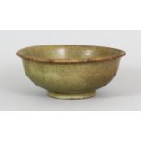 A CHINESE CRACKLEGLAZE STONEWARE BOWL, possibly 18th Century Kwangtung ware, applied all over with a