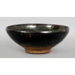 A CHINESE SONG DYNASTY JIAN WARE BOWL, of larger than average size, the predominantly lustrous black