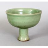 A CHINESE YUAN/MING DYNASTY LONGQUAN CELADON STONEWARE STEM BOWL, with a slightly splayed foot and