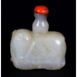 A CHINESE WHITE JADE SNUFF BOTTLE OF A STANDING CAPARISONED ELEPHANT, together with a coral stopper,