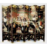 A VERY LARGE EARLY 20TH CENTURY CHINESE LACQUERED WOOD EIGHT FOLD SCREEN, carved and decorated to