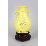 A GOOD QUALITY 18TH/19TH CENTURY CHINESE YELLOW GLAZED MOULDED PORCELAIN VASE, of flattened Hu form,