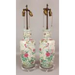 A LARGE PAIR OF 19TH CENTURY CHINESE FAMILLE ROSE ROULEAU VASES, fitted for electricity with perspex