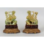 A PAIR OF GOOD QUALITY 19TH/20TH CENTURY CHINESE JADE MODELS OF PHOENIX, together with fixed wood