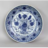 A LARGE CHINESE YONGZHENG PERIOD MING STYLE 'LOTUS BOUQUET' PORCELAIN DISH, of saucer shape, the