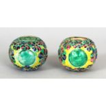 A PAIR OF SMALL 19TH CENTURY CHINESE BISCUIT GLAZED PIERCED GLOBES, one with a pierced 'cash' cover,