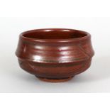 A JAPANESE MEIJI PERIOD STONEWARE CHAWAN, the ribbed sides of the tea bowl with incised bamboo
