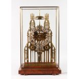 A LARGE VICTORIAN STYLE PIERCED BRASS CATHEDRAL SKELETON CLOCK, with silvered dial, fusee movement