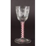 A GEORGIAN COLOURED AIR TWIST WINE GLASS, the bowl engraved with fruiting vines. 5.5ins high.