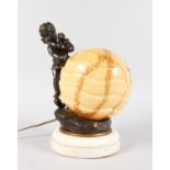 AN ART DECO BRONZE AND MARBLE CUPID LAMP with shade. 12ins high.