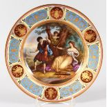 A GOOD VIENNA CIRCULAR PLATE, "Elgrids Pastime" Vienna mark in blue. 24cms diameter.