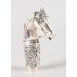 A WHITE METAL HORSES HEAD CANE HANDLE.