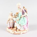 A SUPERB MEISSEN GROUP OF A MOTHER with baby on her lap, young girl by her side. Cross swords mark